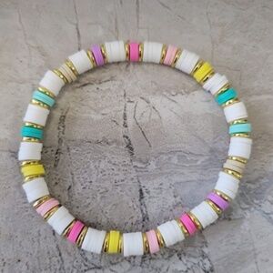 Clay bracelets, seed bead bracelets, and big round beads!